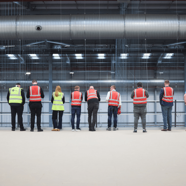 people standing in THG Fulfil warehouse