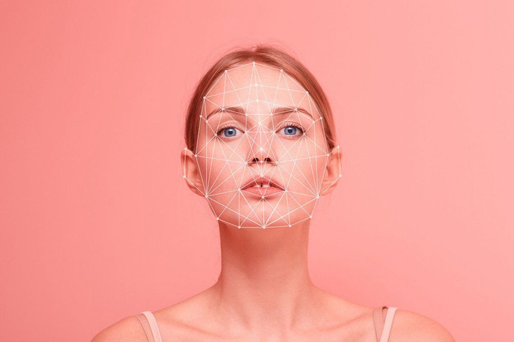 woman with pink background with spider web network connections on her face