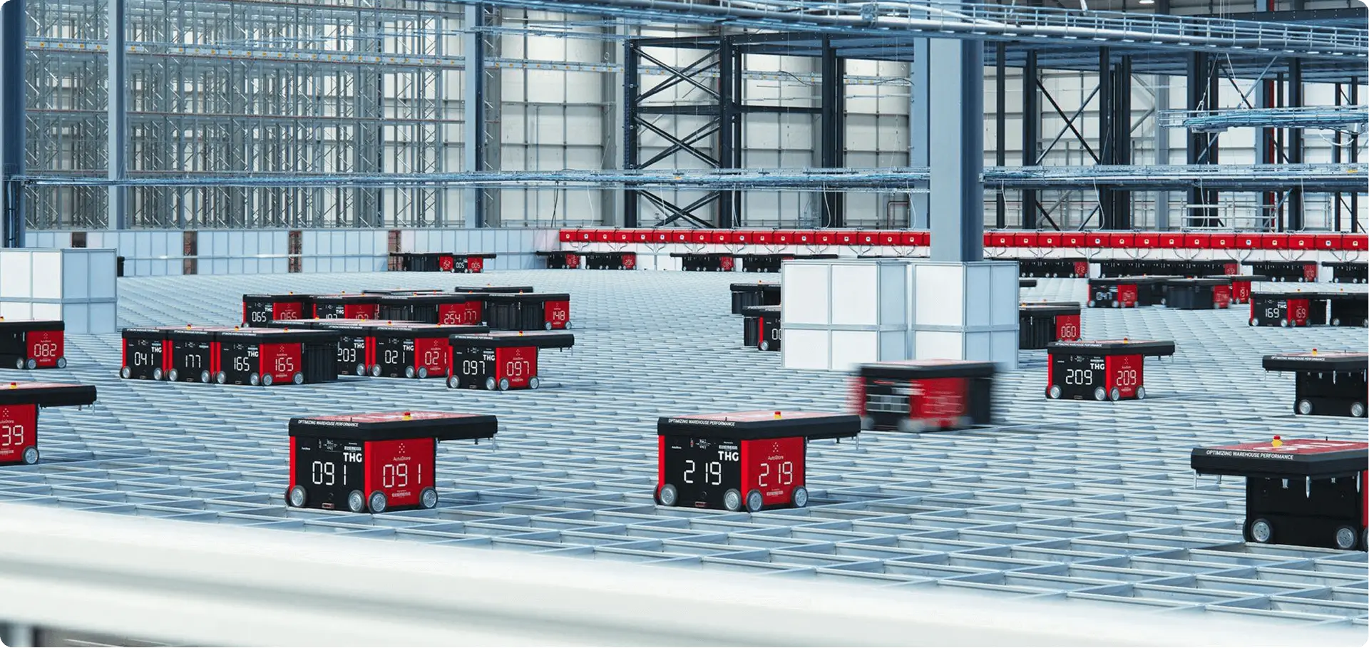 A wide shot of AutoStore robots operating in a THG distribution centre