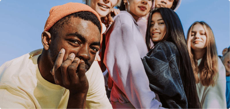 Group of seven people looking directly into the camera