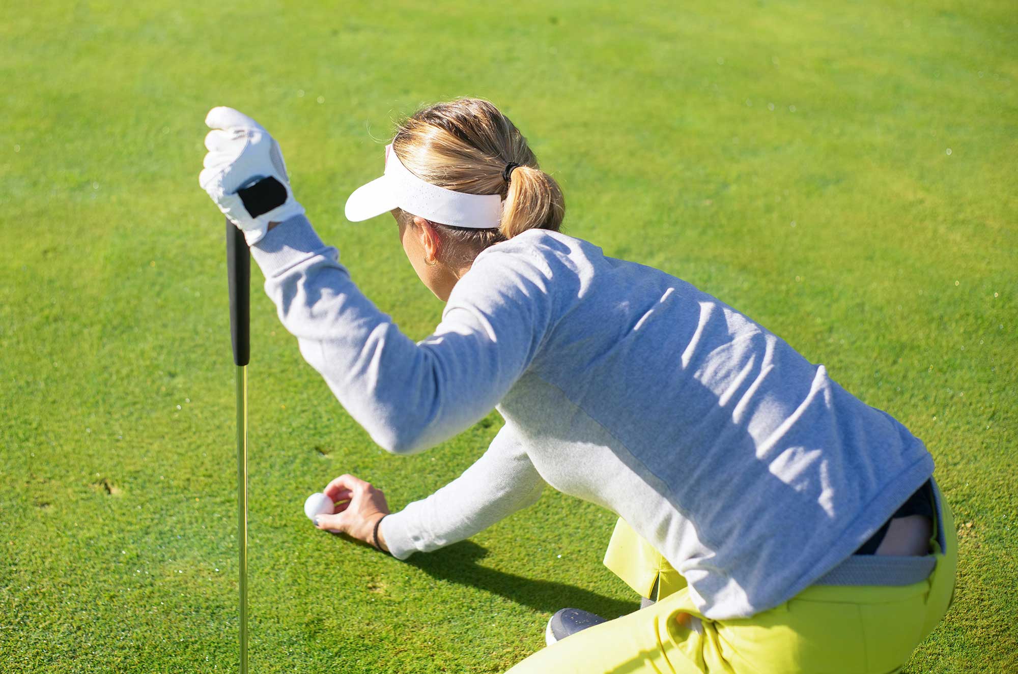 Golfer on green, representing daily SPF for fitness and active lifestyles.