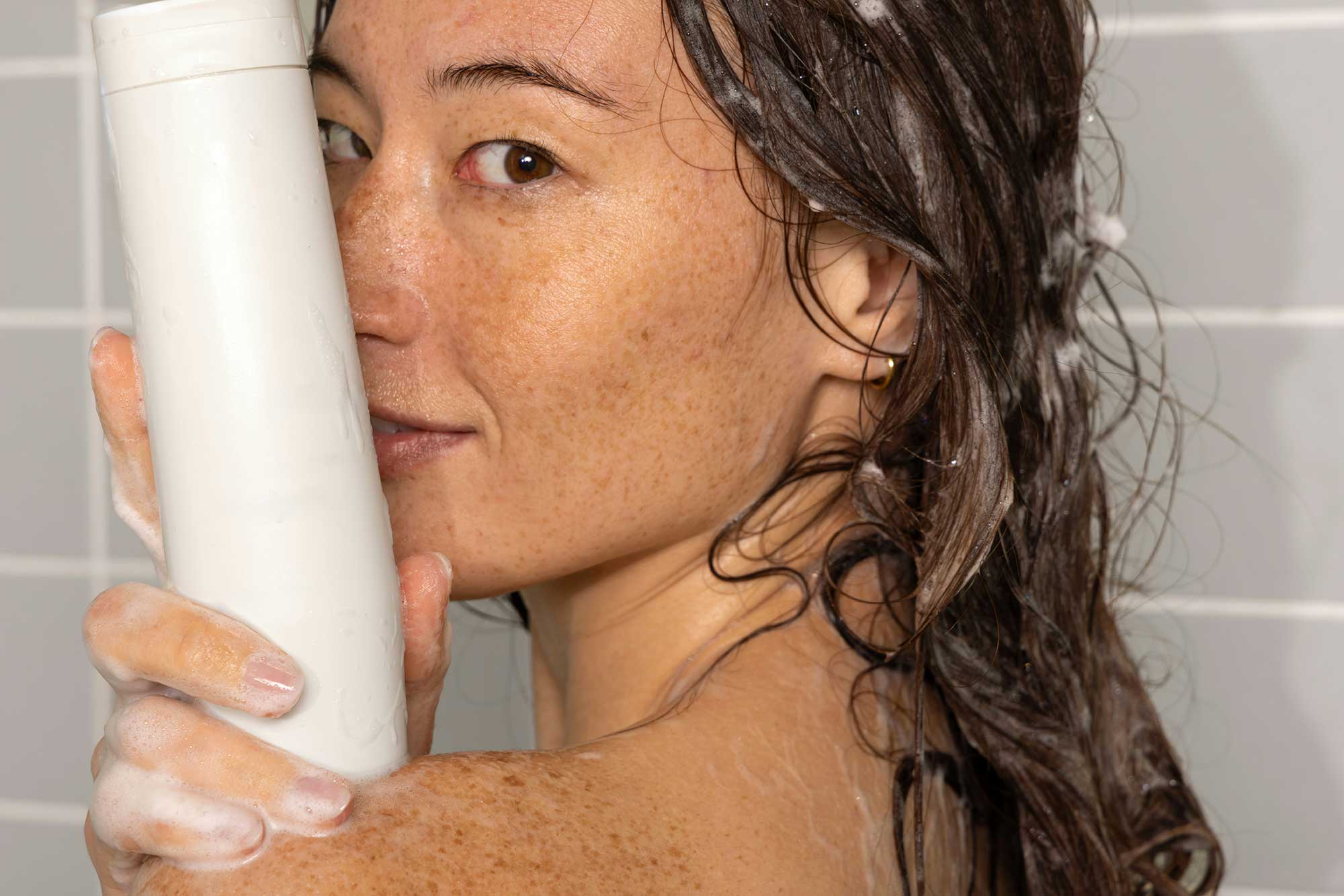 Consumer haircare product in use, showcasing THG LABS expertise in haircare product development and full-service beauty manufacturing