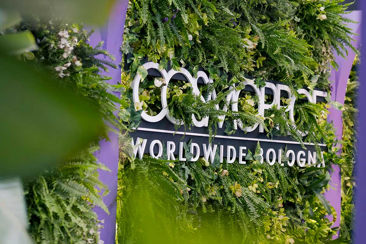 Cosmoprof Worldwide Bologna event signage surrounded by greenery highlighting global beauty industry innovation