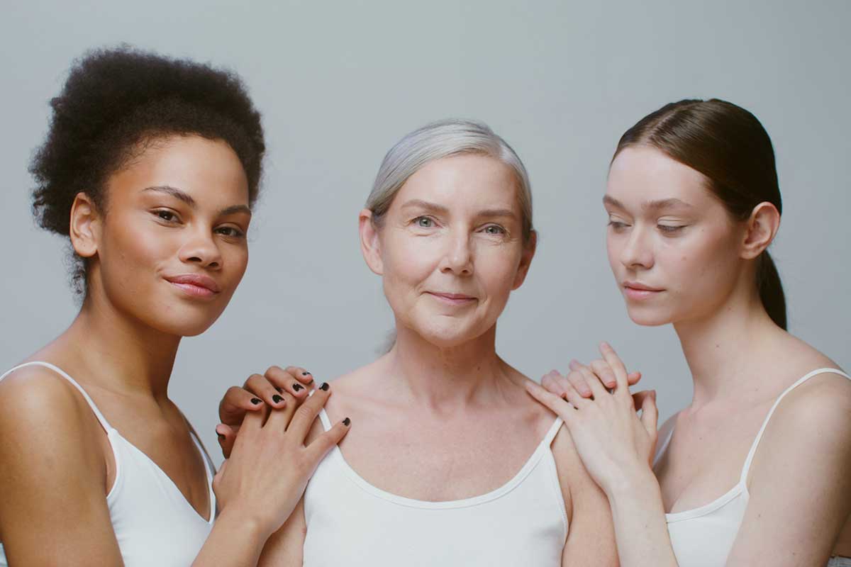 Three women of different ages symbolising cross-generational skincare innovation and longevity-focused cosmetic manufacturing