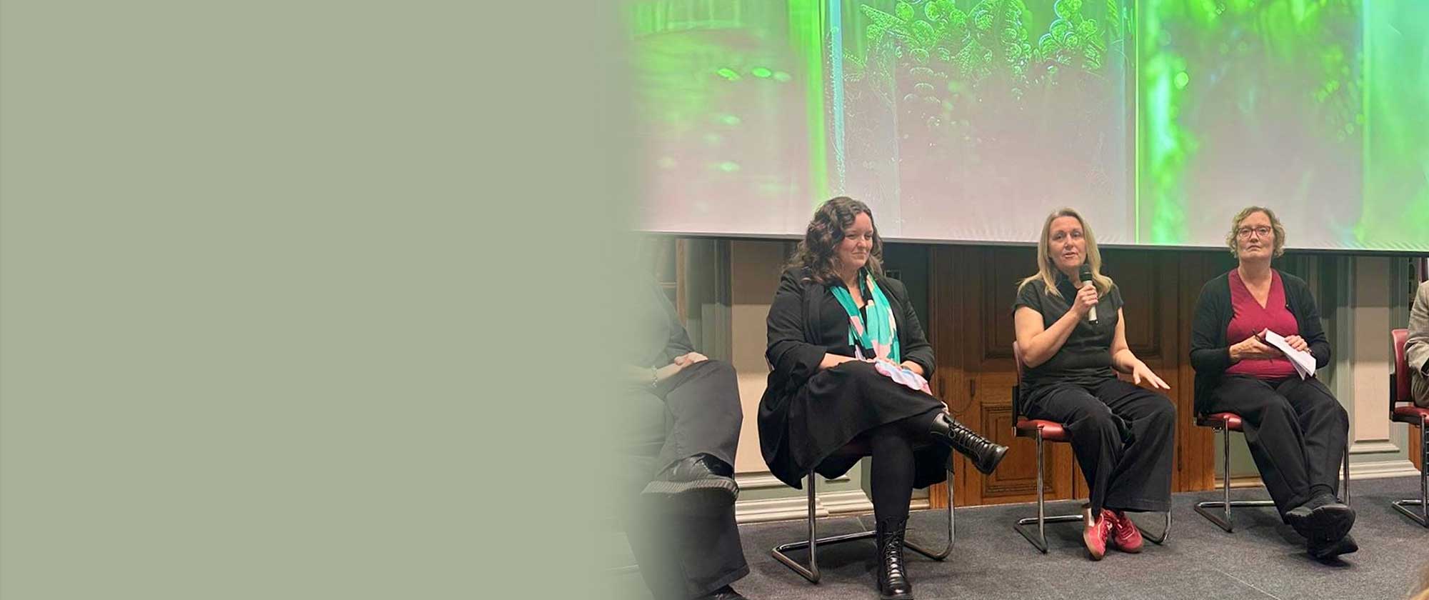 THG LABS Kristal Goodman speaking at the BBIA Demeter Awards in panel session on sustainable innovation and bio-based materials, with green biotechnology visuals on screen behind them.