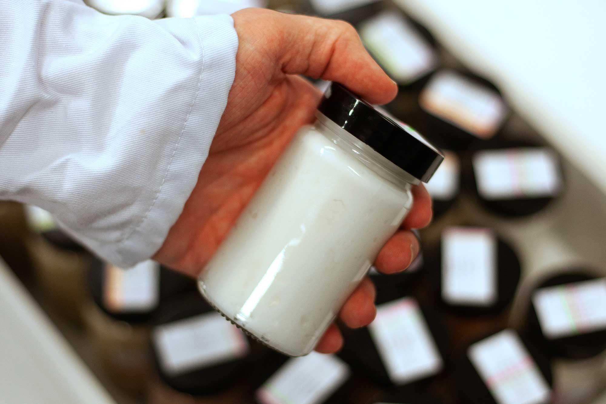 Cosmetic product being assessed for formulation, packaging and manufacturing feasibility when selecting a beauty manufacturing partner.