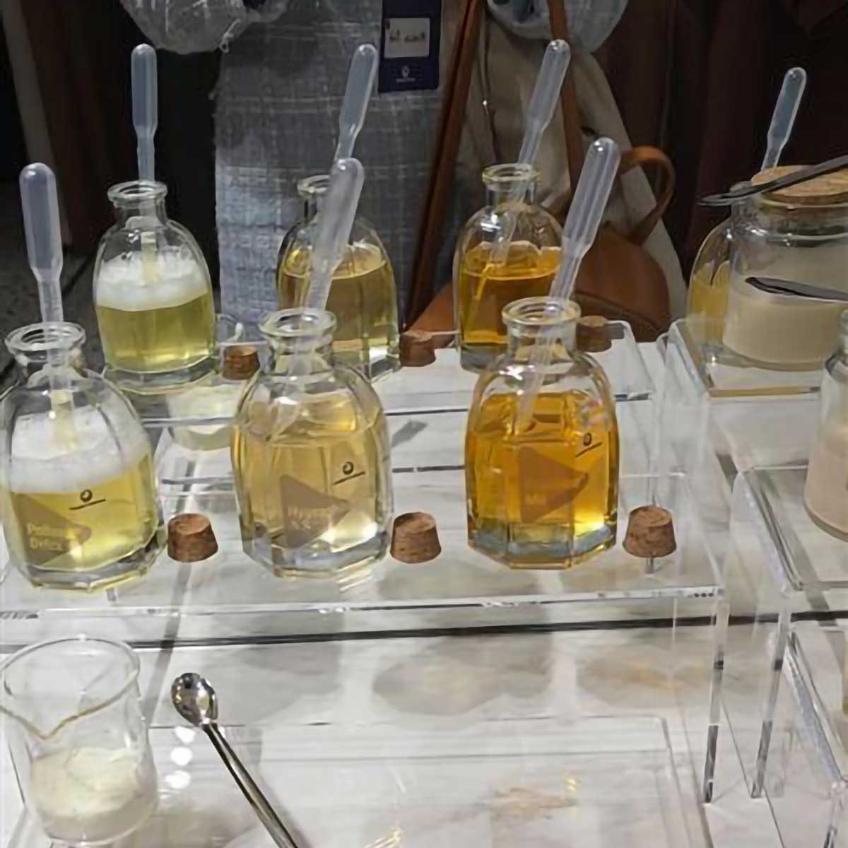 Formulation station with haircare ingredients and testing tools set up for hands-on product development activities at the Chemyunion innovation event.