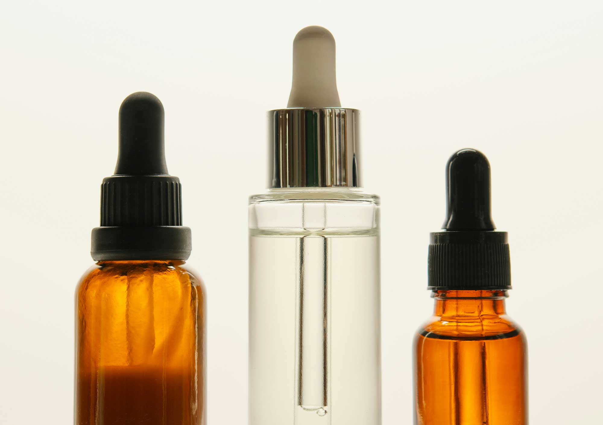 Cosmetic serum packaging used to represent stability testing, formulation compatibility and integrated beauty product development at THG LABS.
