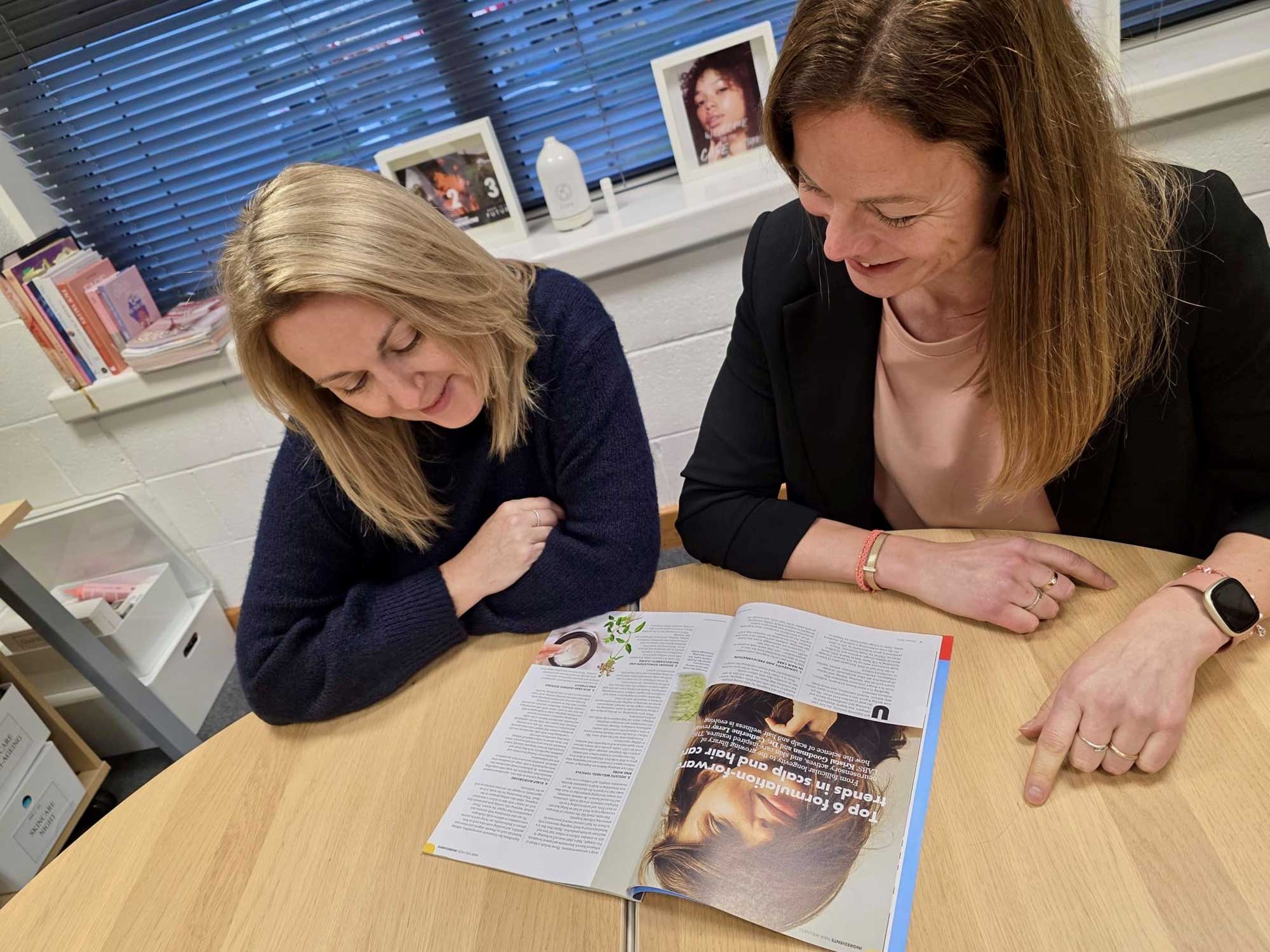 : Kristal Goodman and Catherine Leray from THG LABS reviewing their Cosmetics Business feature on advanced hair and scalp formulation trends.