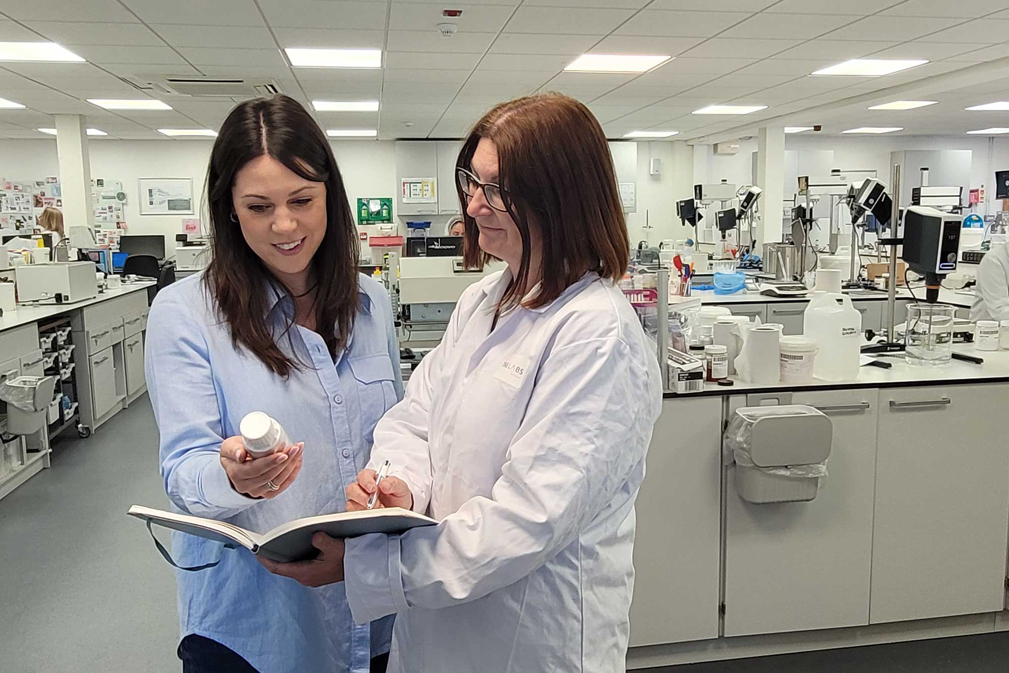 THG LABS cosmetic scientists collaborating in the R&D laboratory, developing innovative dermocosmetic, suncare, and haircare formulations for UK and global beauty brands.