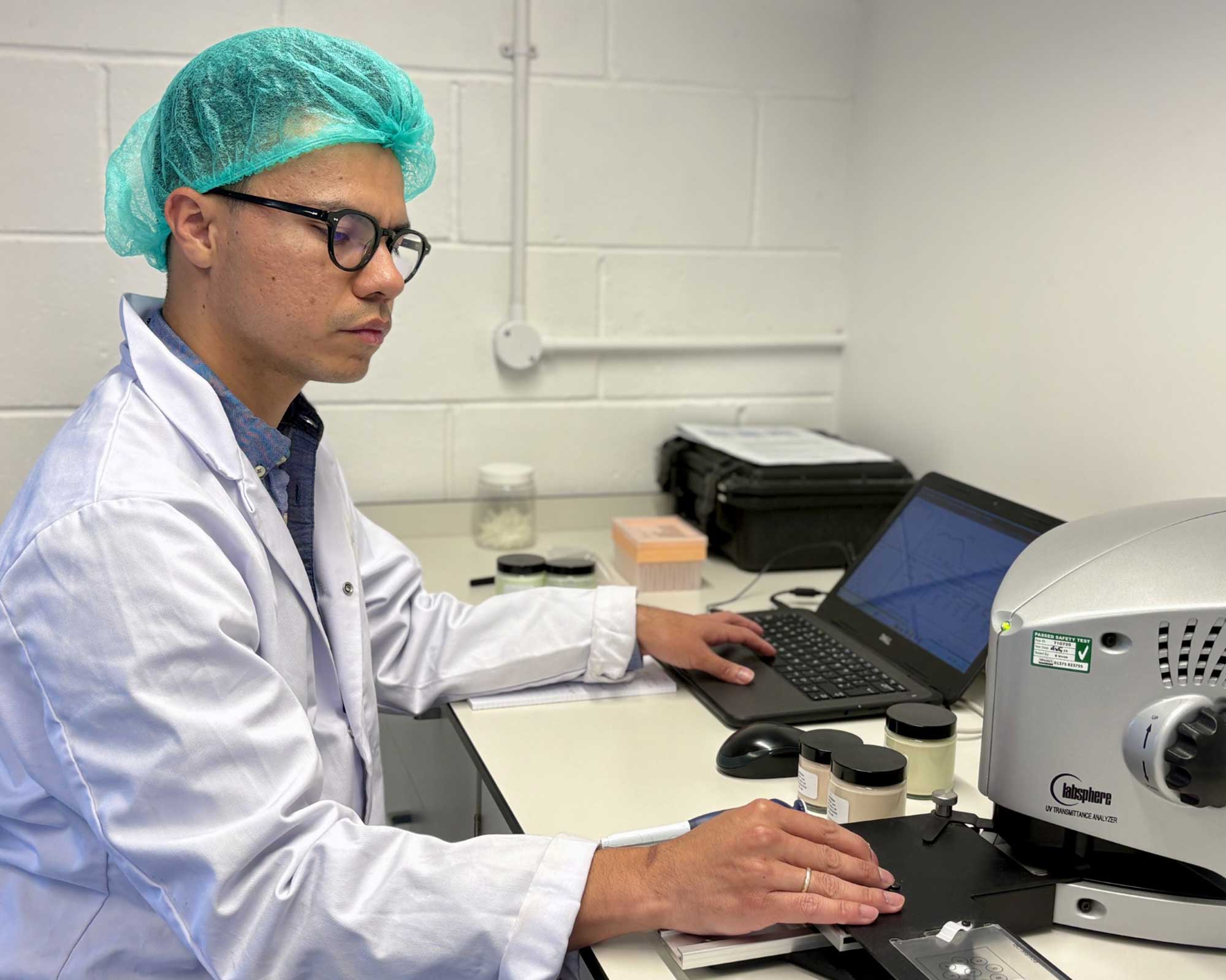 THG LABS scientist conducting SPF formulation testing to support regulatory compliance, product development and claims substantiation.